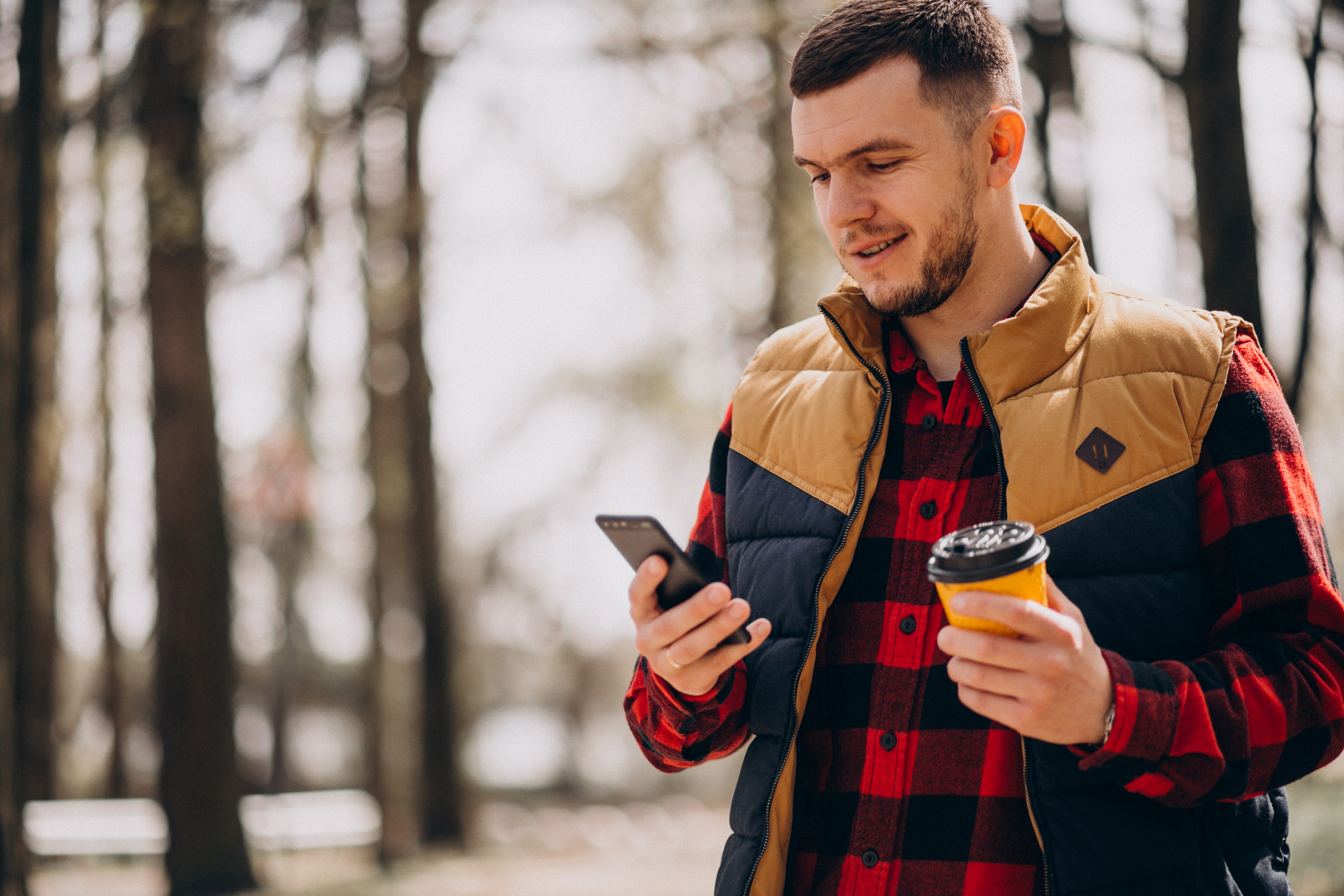Amused by phone in the mountains